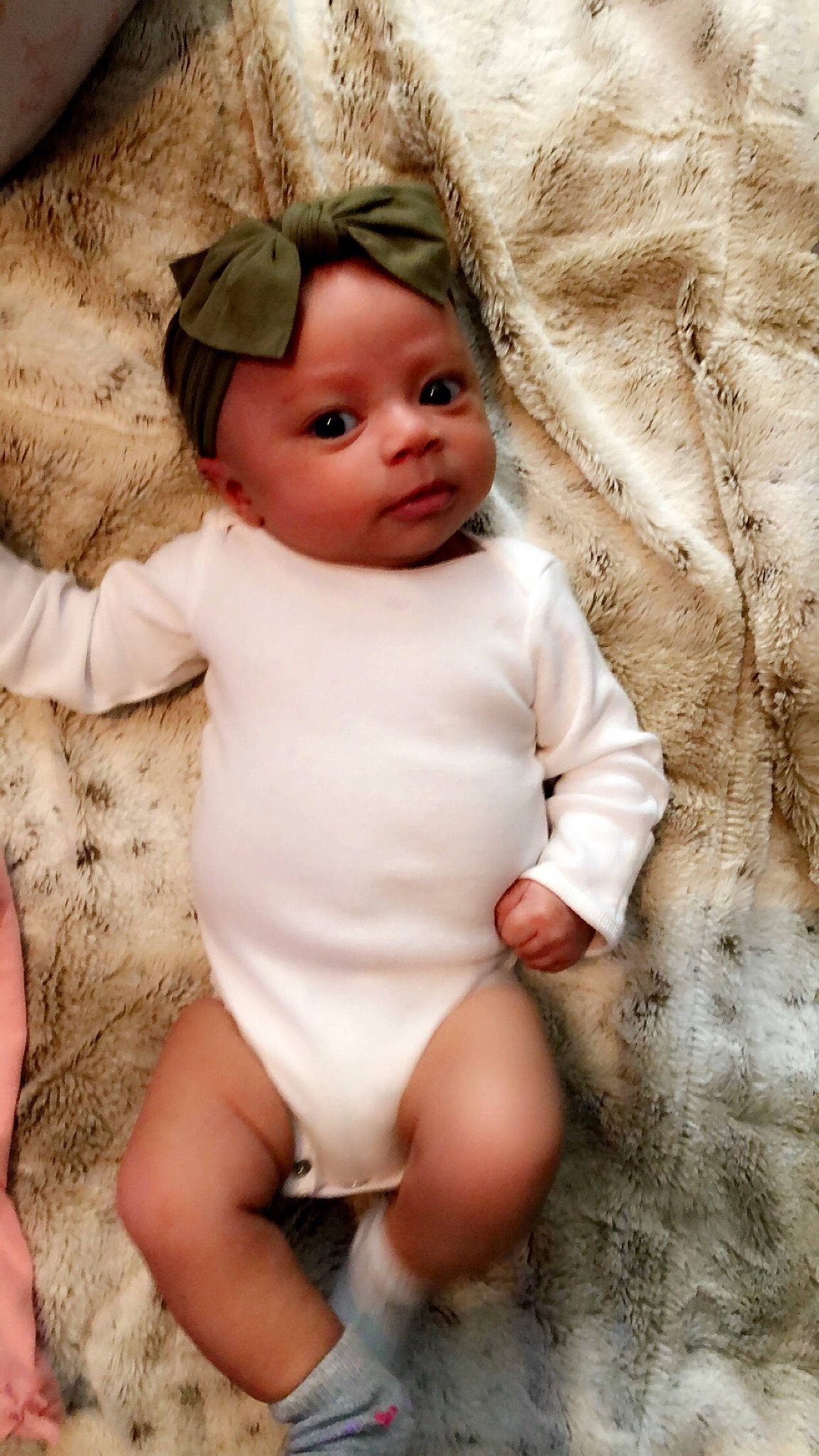 Jemma is registered to the contest to win money with this photo: baby, baby_products, baby_toddler_clothing, child, child_model, fur, headgear, person, product, skin, smile, toddler