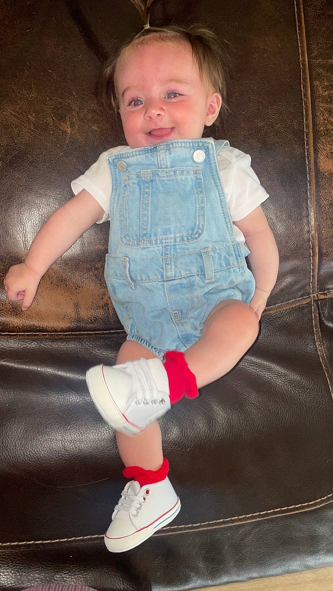 Sawyer is registered to the contest to win money with this photo: baby, baby_toddler_clothing, cheek, finger, flash_photography, fun, human_body, joint, knee, lap, leg, person, pink, skin, sleeve, smile, sock, standing, textile, thigh