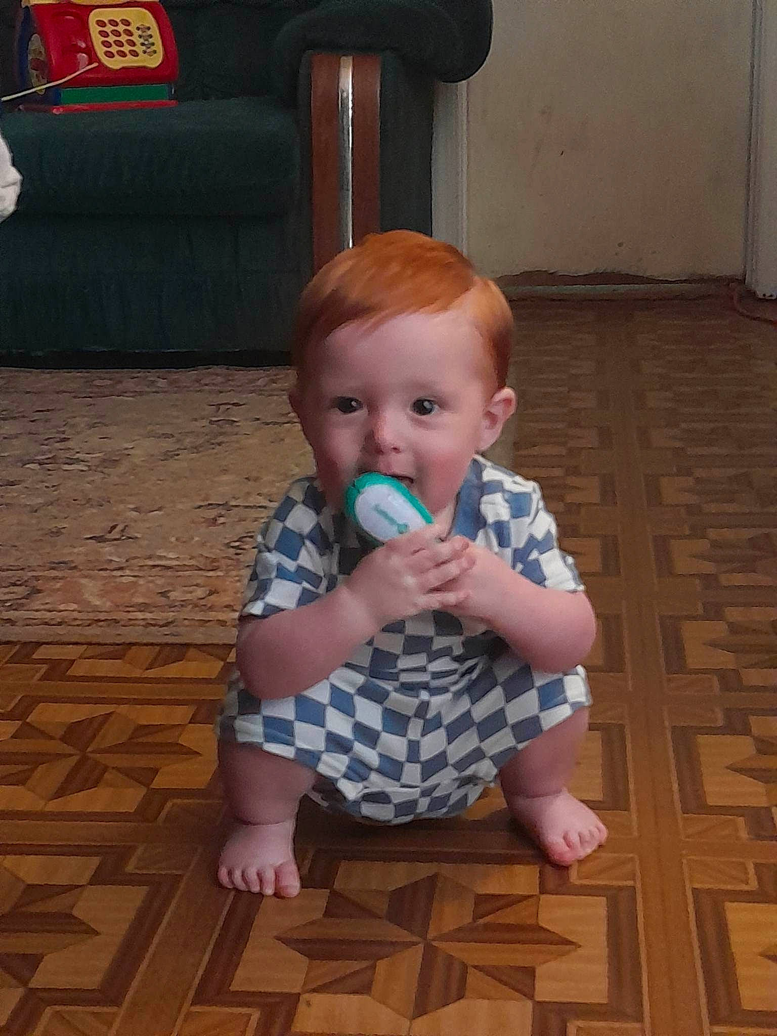 Raylan joined the competition — help win amazing prizes! baby, baby_products, baby_toddler_clothing, cheek, child, chin, floor, flooring, foot, fun, hardwood, laminate_flooring, pattern, person, sitting, thumb, toddler, varnish, wood, wood_flooring