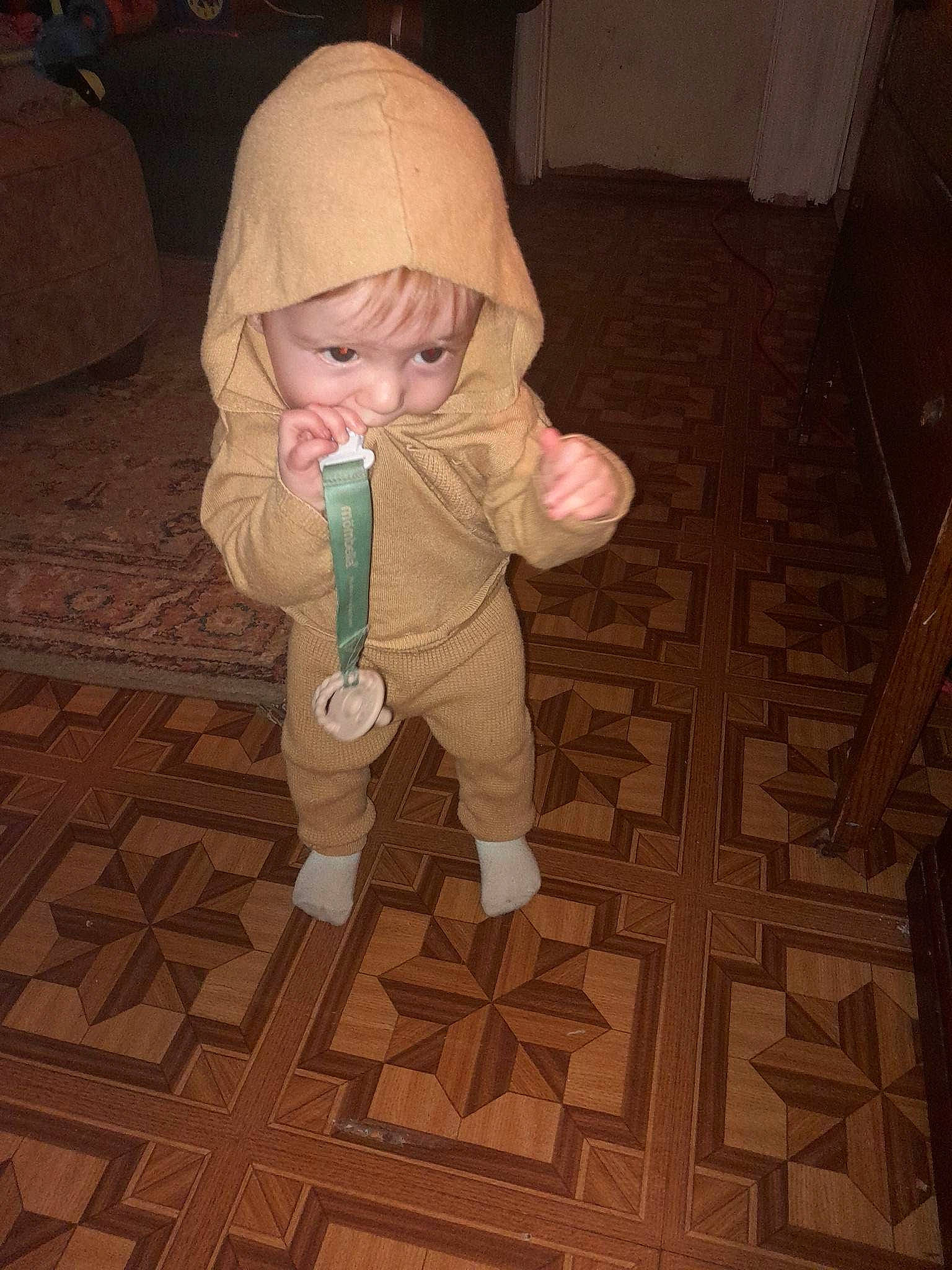 Raylan joined the competition — help win amazing prizes! baby, baby_products, baby_toddler_clothing, carpet, cheek, child, floor, flooring, fun, fur, hardwood, human_body, pattern, person, play, room, sitting, thumb, toddler, wood