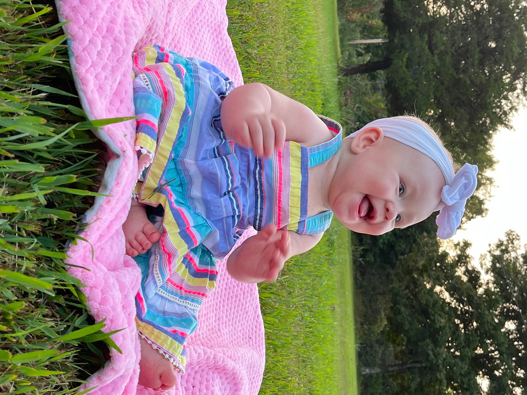 Brinleigh joined the competition — help win amazing prizes! child, fun, grass, grassland, happy, hat, head, leaf, leisure, magenta, meadow, pattern, people_in_nature, person, pink, plant, play, sitting, smile, toddler