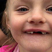 Aviana is registered to the contest to win money with this photo: child, closeup, cute, expression, eye, eyebrow, face, girl, human, innocence, joy, mouth, nose, person, pink_clothing, portrait, skin, smile, teeth, young