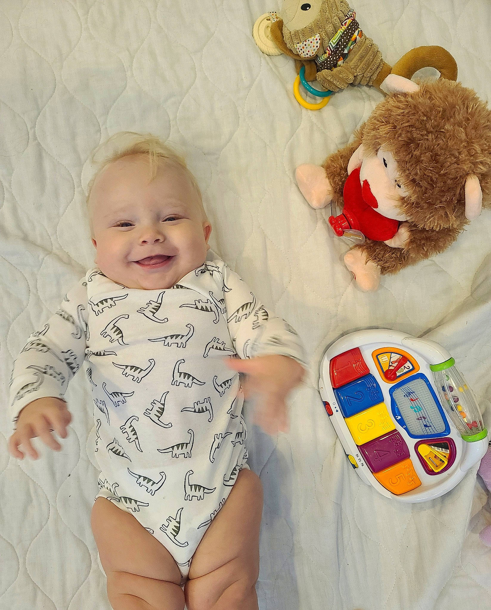 Jericho is registered to the contest to win money with this photo: baby, baby_products, baby_toddler_clothing, baby_toys, child, diaper, joy, pattern, person, play, product, sleeve, textile, toddler