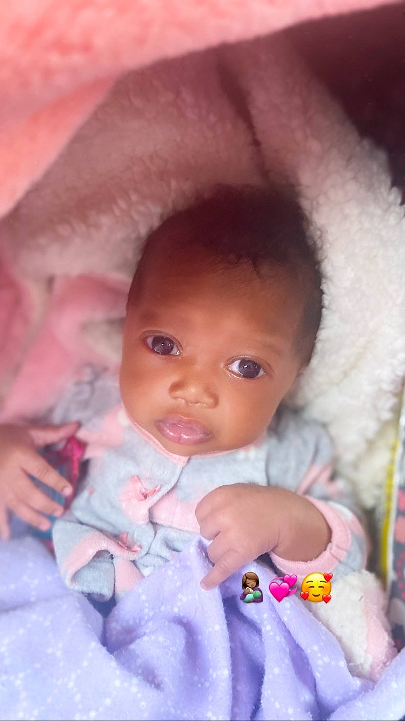 Khalanii is registered to the contest to win money with this photo: baby_toddler_clothing, cheek, chin, dress, eye, eyebrow, eyelash, face, hairstyle, happy, head, iris, lip, mouth, nose, outerwear, person, purple, skin, smile