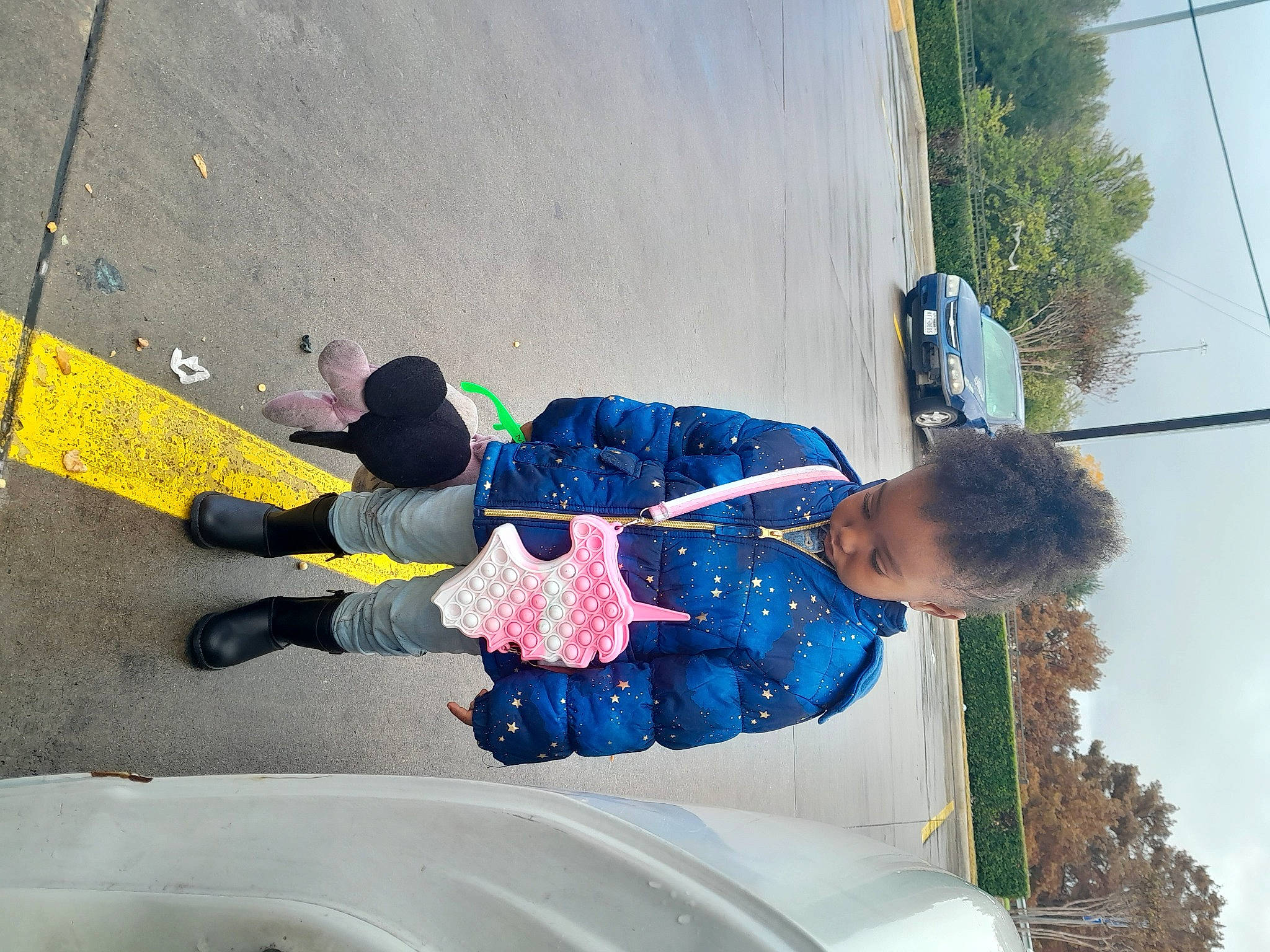 Kyra joined the competition — help win amazing prizes! asphalt, child, concrete, electric_blue, fun, leisure, person, plant, recreation, road_surface, sidewalk, sky, toddler, tree, yellow