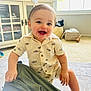 Daniel joined the competition — help win amazing prizes! toddler, child, smiling, indoor, carpet, cabinet, window, toy, clothing, person, happy, blue_eyes, short_sleeves, sock, furniture, room, daylight, holding, patterned_shirt, floor