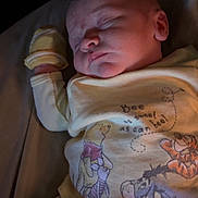 Jordan is registered to the contest to win money with this photo: baby, bed, blanket, bodypart, cradle, crib, cushion, face, finger, furniture, hand, head, homedecor, infantbed, newborn, person, photography, portrait, quilt, sleeping