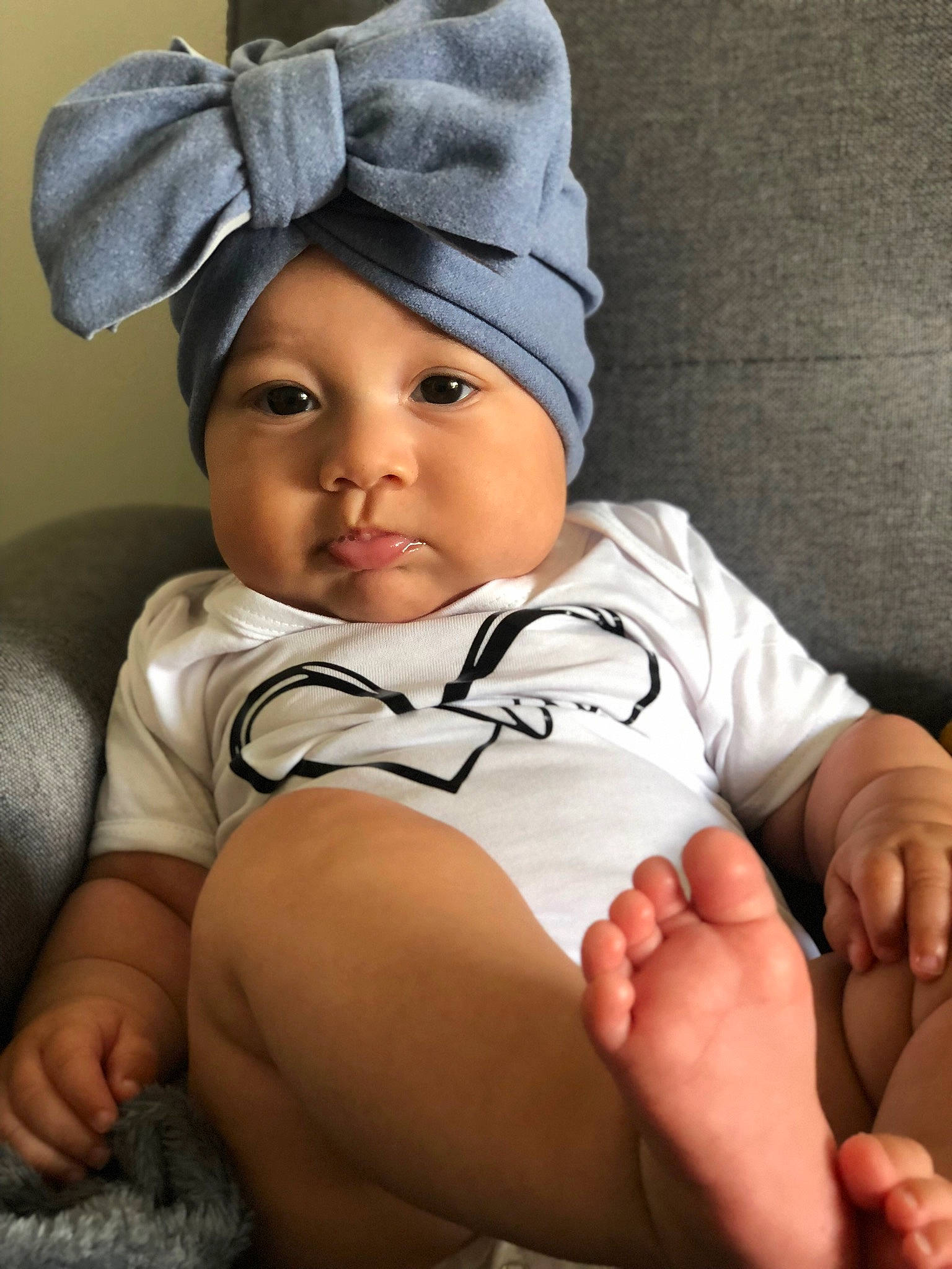 Lesya participe au concours pour gagner de l'argent avec cette photo : baby, baby_toddler_clothing, cap, cheek, chin, comfort, eye, finger, flash_photography, gesture, headgear, headwear, human_body, knee, mammal, mouth, person, skin, sleeve, standing