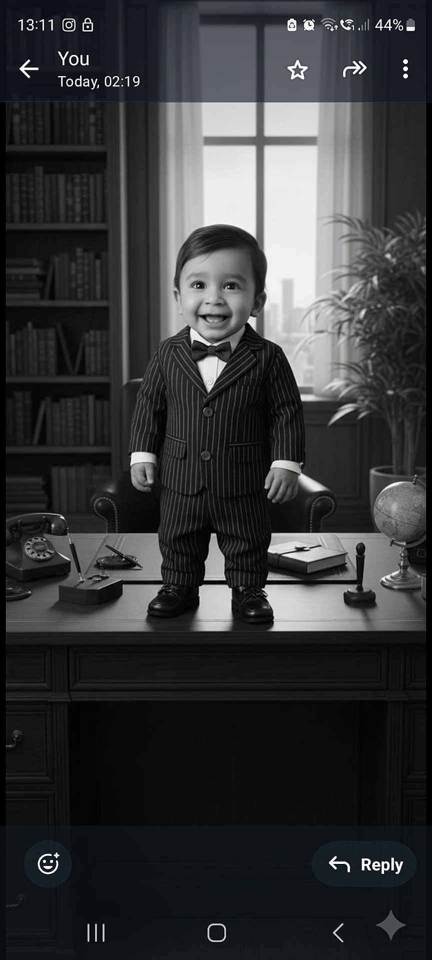 Rudransh is registered to the contest to win money with this photo: toddler, child, suit, bow_tie, desk, office, black_and_white, smile, bookshelf, book, globe, plant, rotary_phone, window, chair, vintage, portrait, indoor, person, formal_wear
