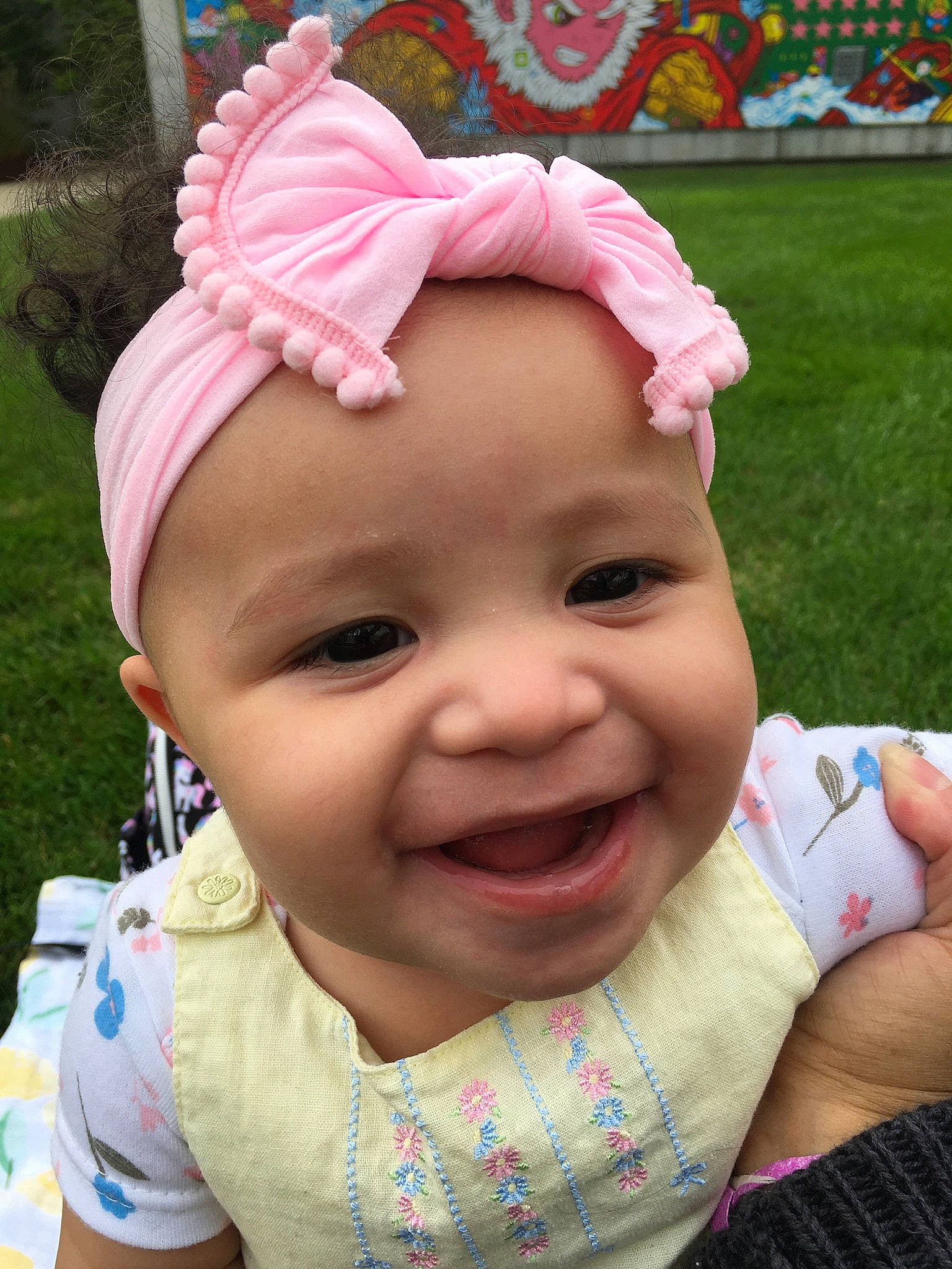 Amaris is registered to the contest to win money with this photo: baby, cap, cheek, child, chin, face, grass, happy, hat, headgear, headwear, iris, joy, lip, mouth, nose, person, pink, skin, smile