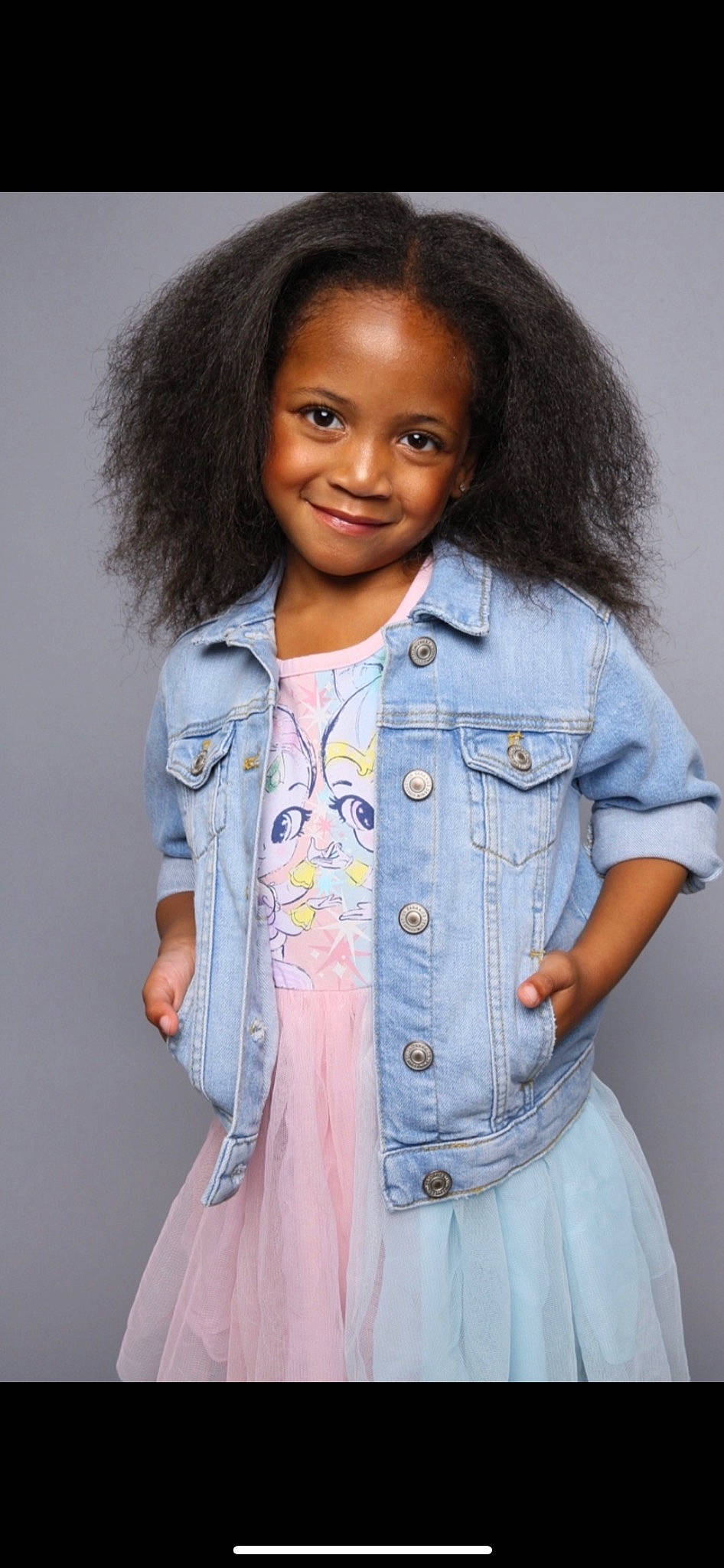 Parker joined the competition — help win amazing prizes! chin, clothing, dress_shirt, eye, facial_expression, fashion, hair, hairstyle, head, human, joy, lip, organ, outerwear, person, purple, skin, sleeve, smile, standing