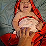 Exavian is registered to the contest to win money with this photo: baby, child, towel, laughing, smiling, hand, tickling, bed, blanket, red, blue, skin, happy, infant, person, cute, playful, cozy, wrapped, indoors