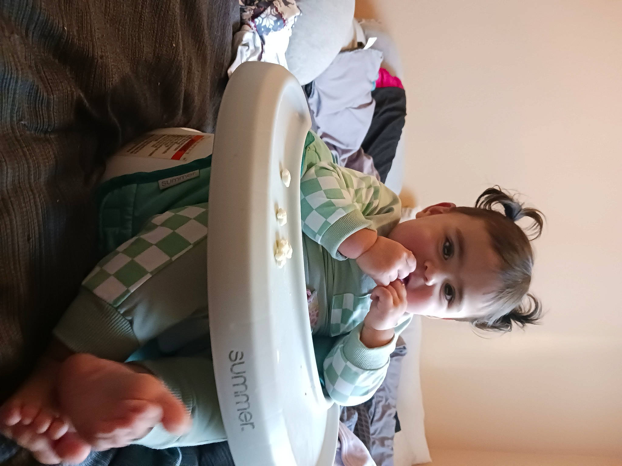 Rosie is registered to the contest to win money with this photo: baby, child, elbow, eyelash, eyewear, fashion_accessory, finger, fun, gesture, happy, joint, nail, person, personal_protective_equipment, sitting, sleeve, sunglasses, toddler, tree, water