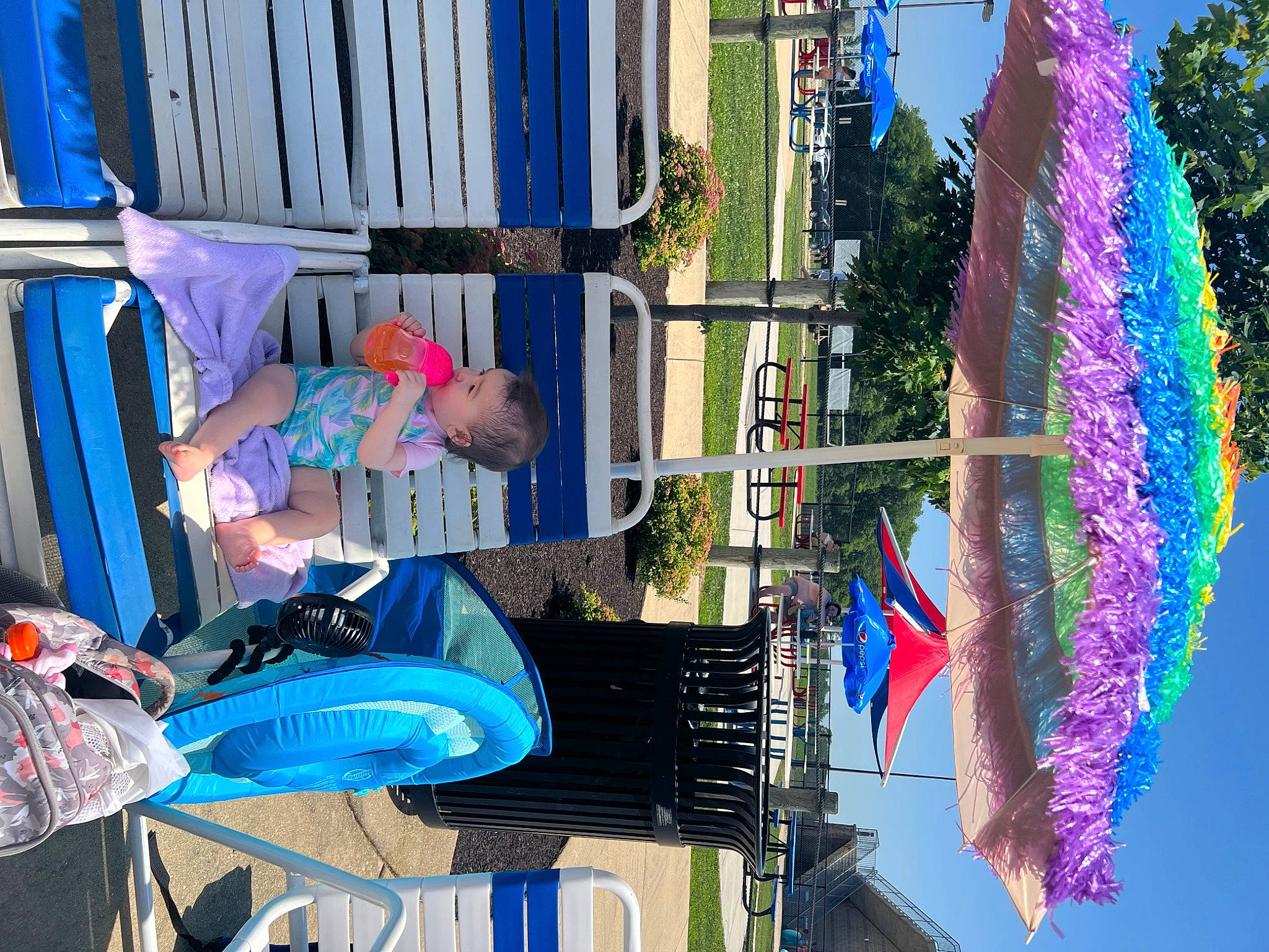 Natalia is registered to the contest to win money with this photo: azure, blue, electric_blue, event, flag, fun, hat, leisure, line, nonbuilding_structure, people, person, photograph, pole, recreation, sky, t_shirt, tree, vacation, water