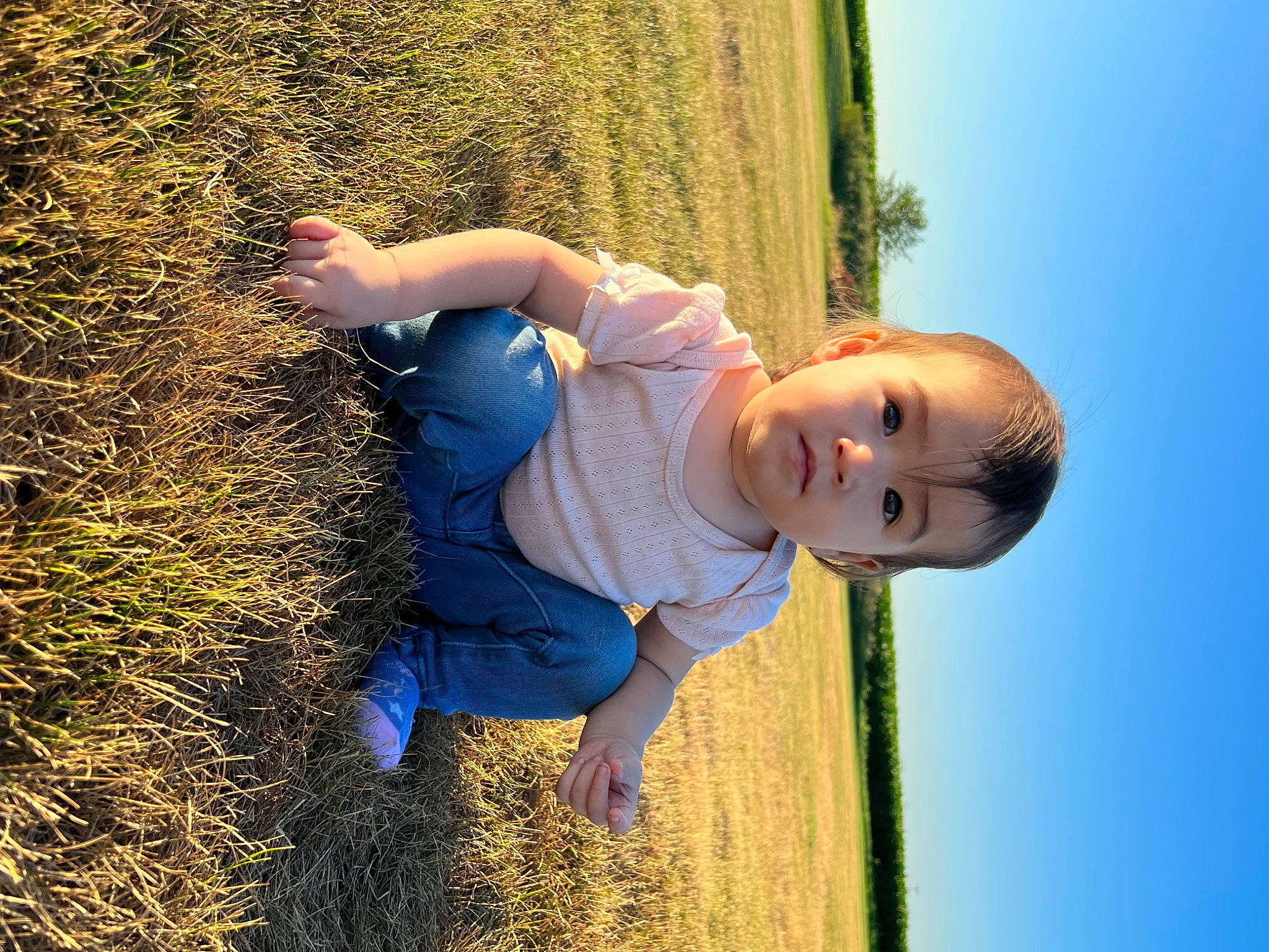 Natalia is registered to the contest to win money with this photo: azure, child, elbow, electric_blue, flash_photography, fun, grass, grassland, hand, happy, leisure, people_in_nature, person, plant, sky, smile, sunlight, t_shirt, toddler, tree