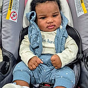 Nevaeh-Celeste joined the competition — help win amazing prizes! baby, child, car_seat, pink, blue_clothing, headband, polka_dots, footwear, indoor, seat_belt, cute, portrait, infant, person, clothing, face, baby_girl, sitting, expression, cozy