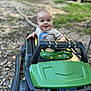 Reid joined the competition — help win amazing prizes! baby, child, toy_car, green, outdoor, grass, rocks, happy, smiling, vehicle, play, nature, cute, person, toddler, daylight, jeep, shirt, expression, fun