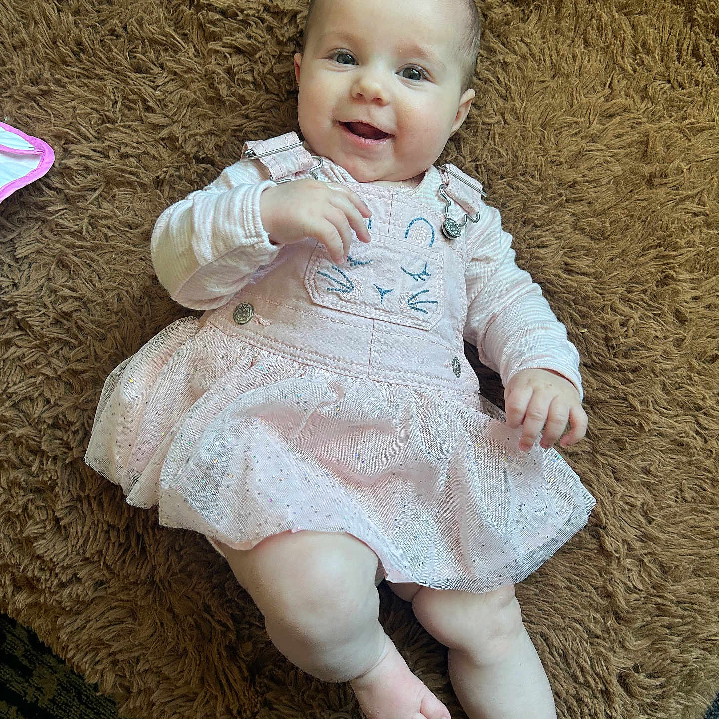 Izabella is registered to the contest to win money with this photo: baby, bodypart, clothing, couch, cushion, dress, face, finger, furniture, hand, happy, head, homedecor, newborn, pants, person, photography, portrait, sitting, smile