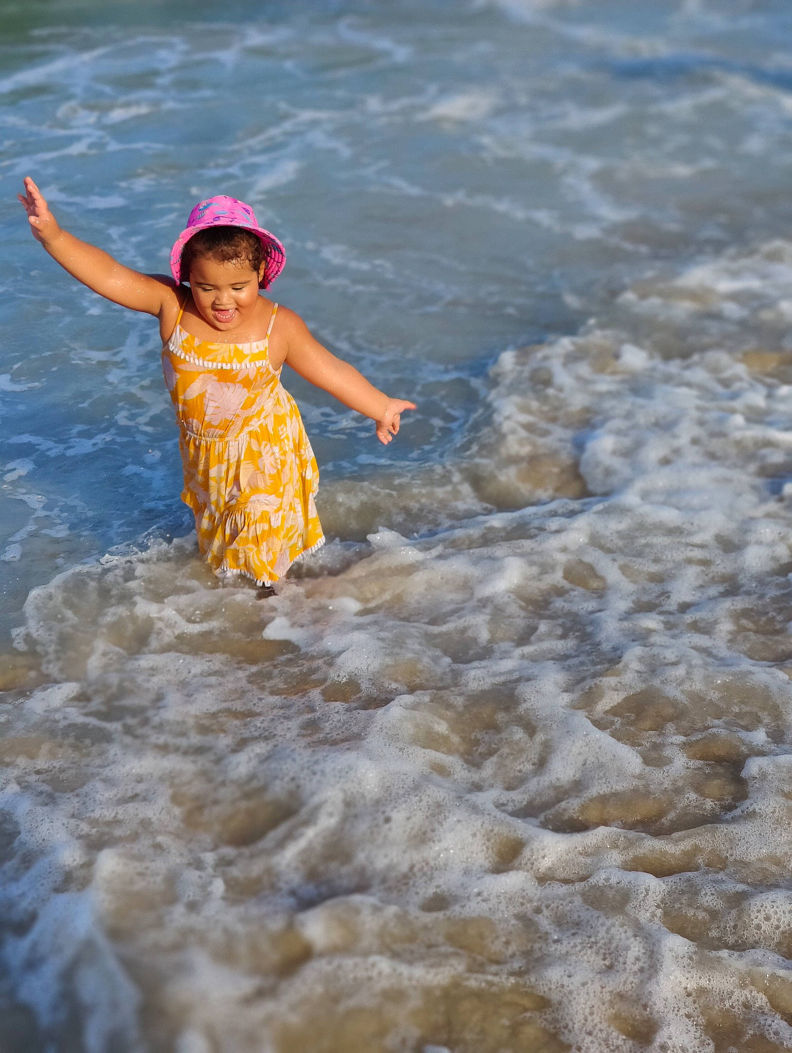 Marleigh Deanne is registered to the contest to win money with this photo: beach, coast, coastal_and_oceanic_landforms, dress, flash_photography, fun, happy, hat, horizon, landscape, leisure, people_in_nature, people_on_beach, person, shore, shorts, sky, smile, toddler, water