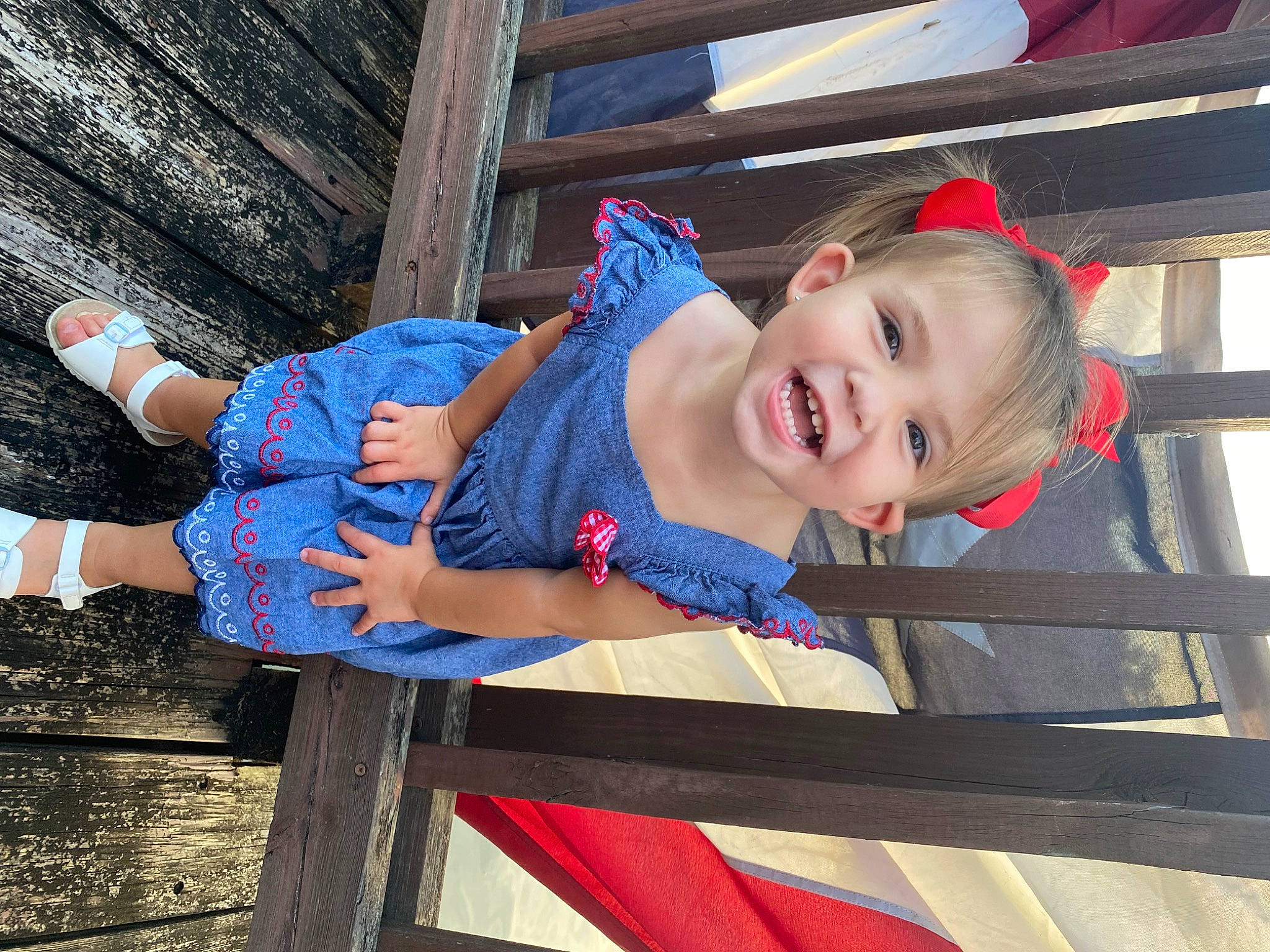 Claire joined the competition — help win amazing prizes! baby_toddler_clothing, child, city, electric_blue, fun, happy, leisure, person, recreation, sitting, smile, thigh, toddler, travel, vacation, wood