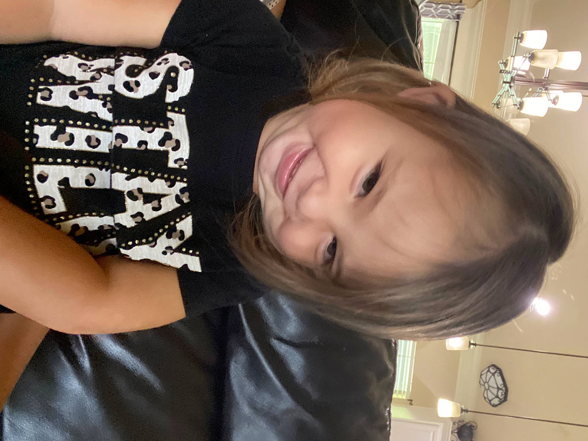 Claire is registered to the contest to win money with this photo: black_hair, blond, brown_hair, cheek, child, cool, elbow, eyebrow, eyelash, facial_expression, fun, hairstyle, happy, joy, long_hair, neck, person, shoulder, sitting, sleeve