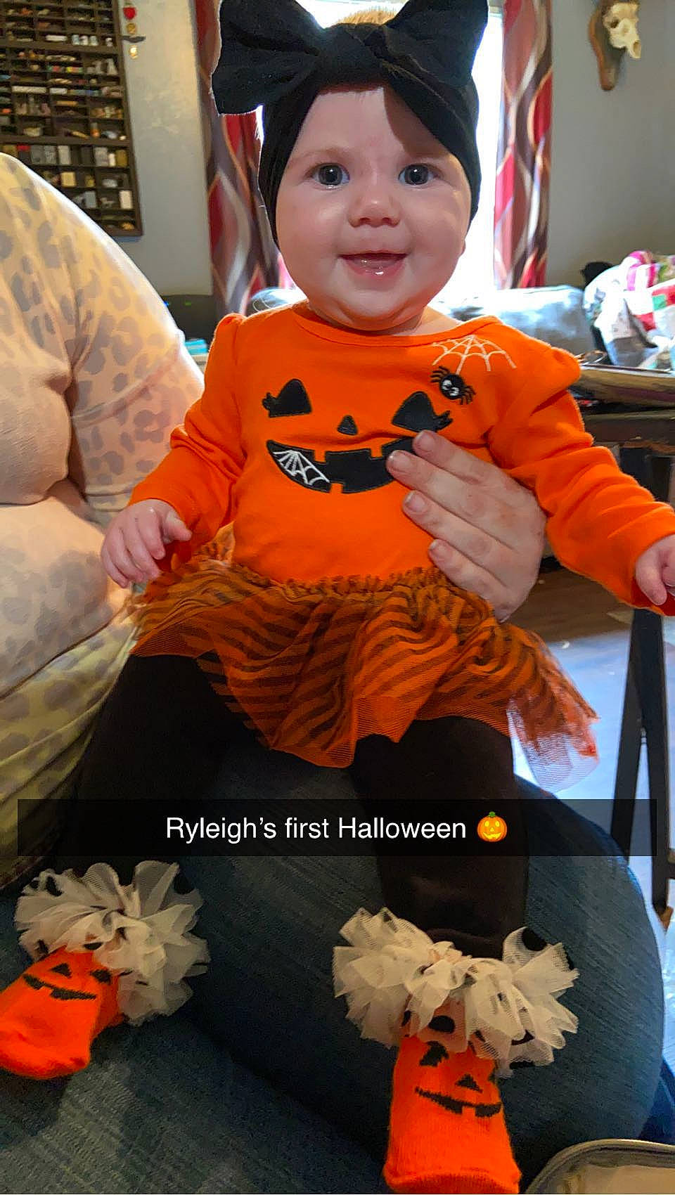 Ryleigh is registered to the contest to win money with this photo: baby, baby_toddler_clothing, child, clothing, event, face, fashion, happy, head, headwear, orange, person, photograph, product, sitting, sleeve, smile, t_shirt, textile, toddler