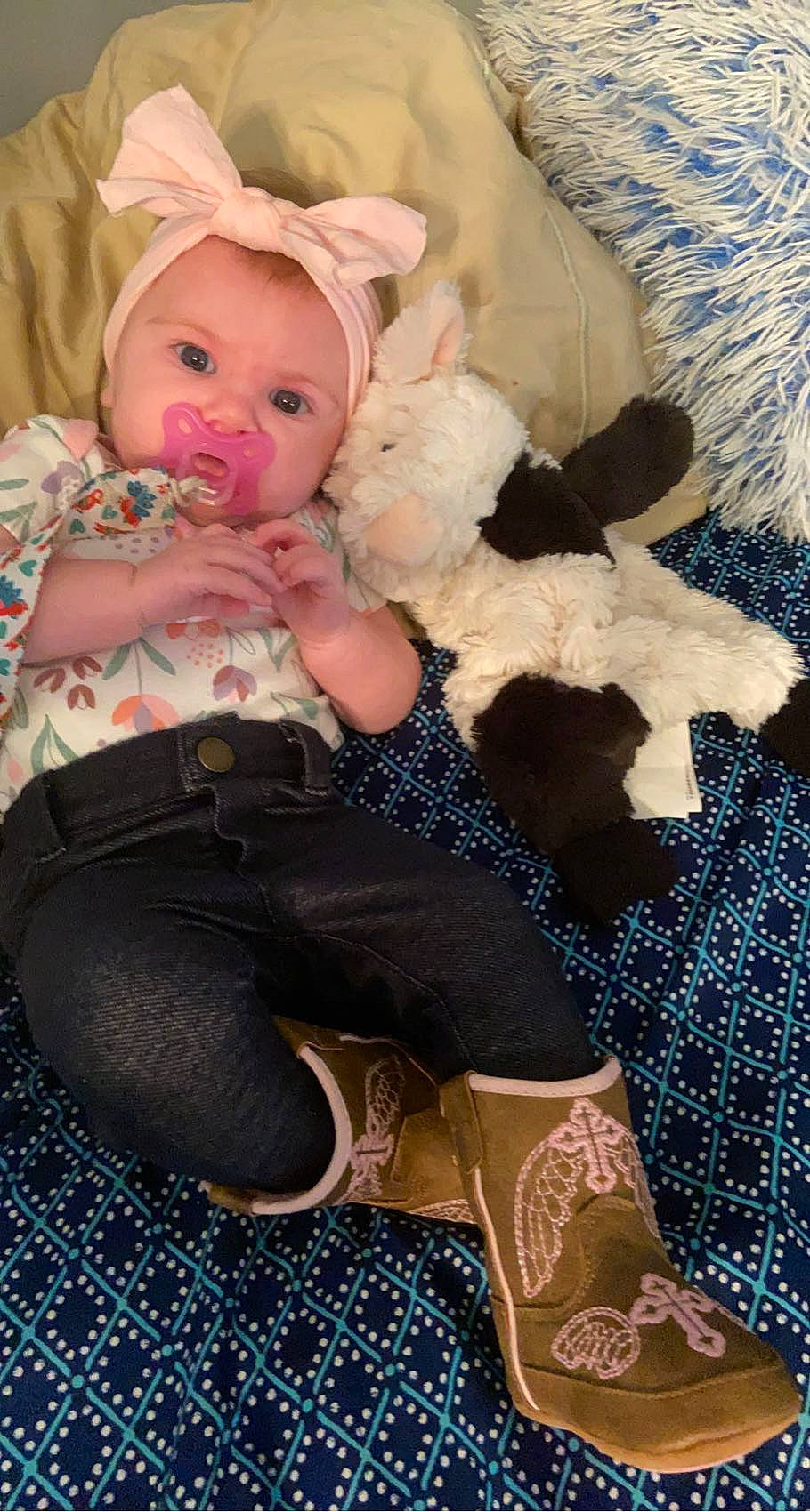 Ryleigh is registered to the contest to win money with this photo: baby, baby_toddler_clothing, blue, cheek, child, comfort, doll, eye, fur, headwear, human_body, lap, pattern, person, plush, sitting, skin, stuffed_toy, teddy_bear, thigh