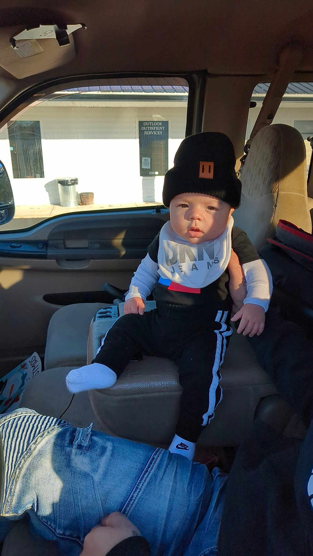 Jayden is registered to the contest to win money with this photo: baseballcap, cap, clothing, coat, cushion, face, footwear, hat, head, homedecor, hosiery, jacket, jeans, pants, person, photography, portrait, shoe, sitting, sock