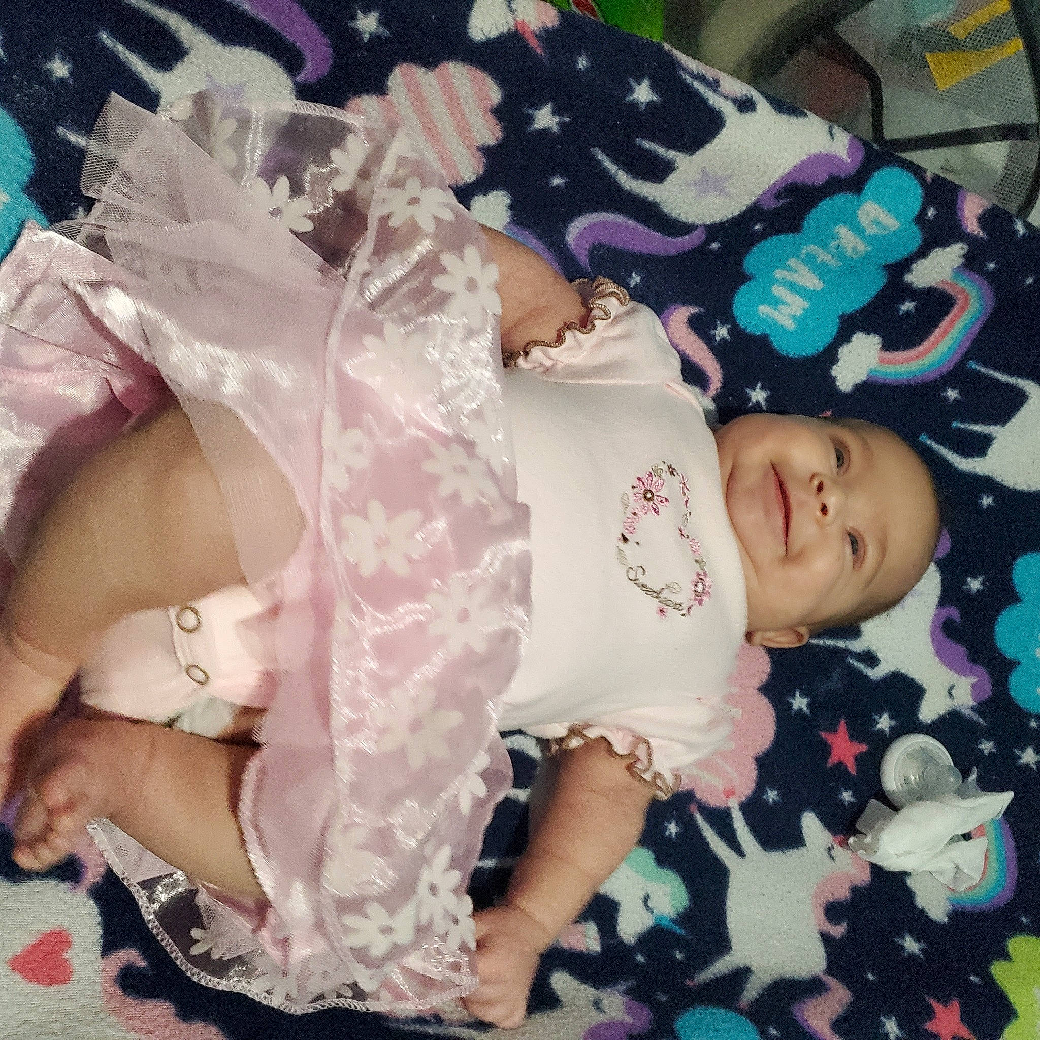 Primrose is registered to the contest to win money with this photo: baby_toddler_clothing, chest, child, cloud, cool, embellishment, fashion_accessory, hairstyle, hand, happy, jewellery, joy, pattern, person, pink, purple, skin, sleeve, smile, thigh