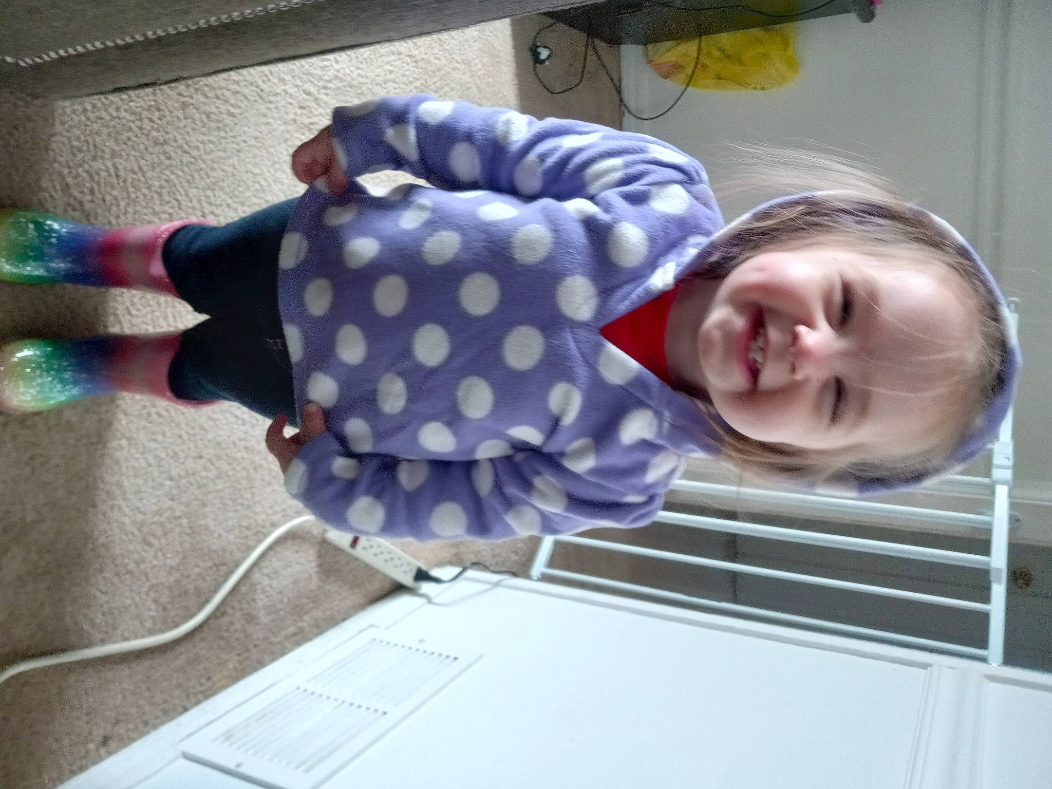 Addilynn is registered to the contest to win money with this photo: baby, baby_toddler_clothing, child, comfort, electric_blue, flooring, fun, joy, magenta, pattern, person, play, room, smile, toddler