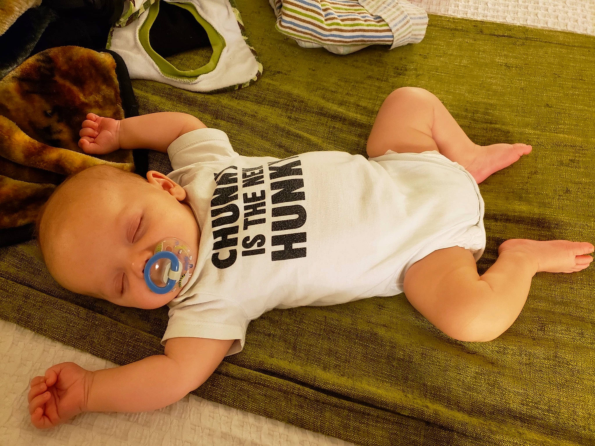 Blake is registered to the contest to win money with this photo: baby, baby_toddler_clothing, comfort, elbow, floor, flooring, foot, grass, happy, human_leg, joint, knee, leg, mouth, person, sitting, thigh, toddler, trunk, waist