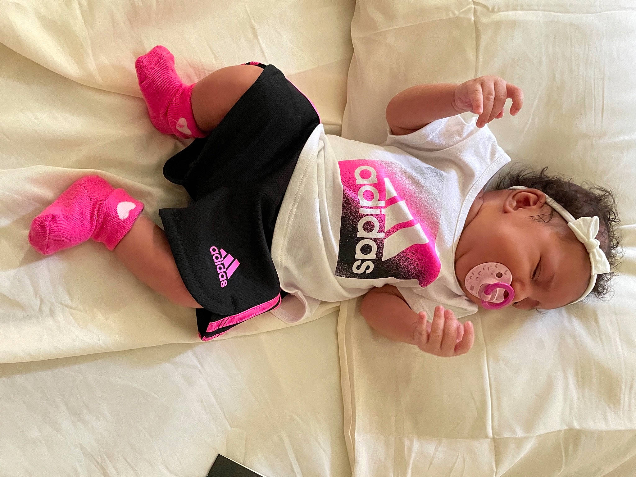 Lovee joined the competition — help win amazing prizes! abdomen, baby_sleeping, baby_toddler_clothing, bed, bedding, comfort, couch, facial_expression, finger, happy, human_body, knee, linens, magenta, person, pink, sleeve, sportswear, textile, thigh