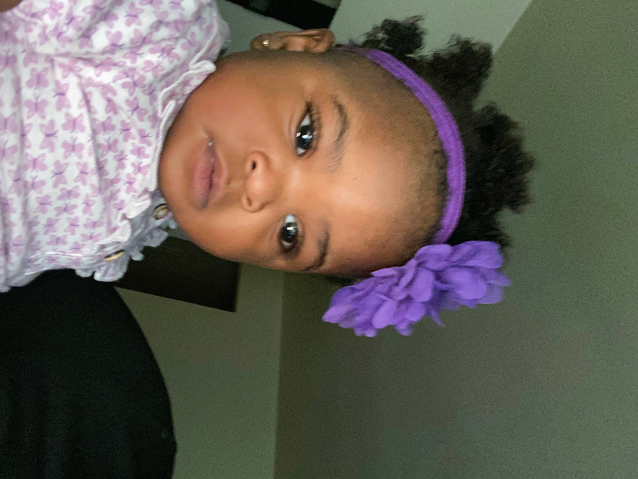 Dmariah is registered to the contest to win money with this photo: black_hair, cheek, ear, eye, eyebrow, eyelash, forehead, hair, iris, lip, magenta, neck, nose, person, pink, plant, purple, skin, smile, toddler