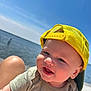 Hardin is registered to the contest to win money with this photo: baby, child, smiling, yellow_cap, mesh_cap, outdoor, sunny, water, lake, blue_sky, happy, tshirt, infant, face, headwear, summer, portrait, nature, skin, daylight