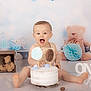baby, cake, teddy_bear, birthday, first_birthday, smiling, child, decorations, toy, celebration, white_cake, floor_reflection, number_one, wooden_box, birthday_cake, happy, portrait, indoor, cute, party