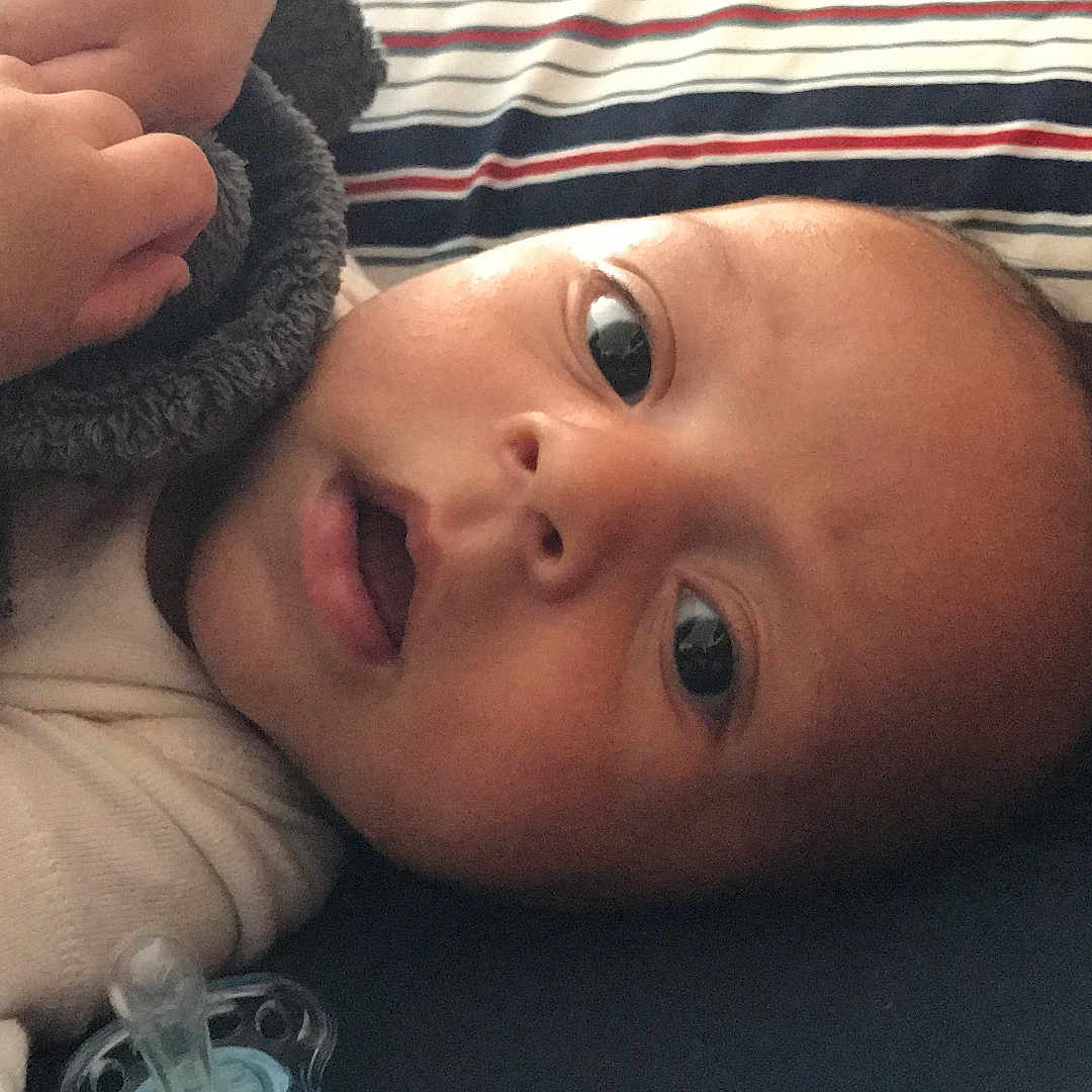 Logan is registered to the contest to win money with this photo: cheek, child, eye, finger, girl, hand, head, infant, lip, mouth, nose, product, toddler