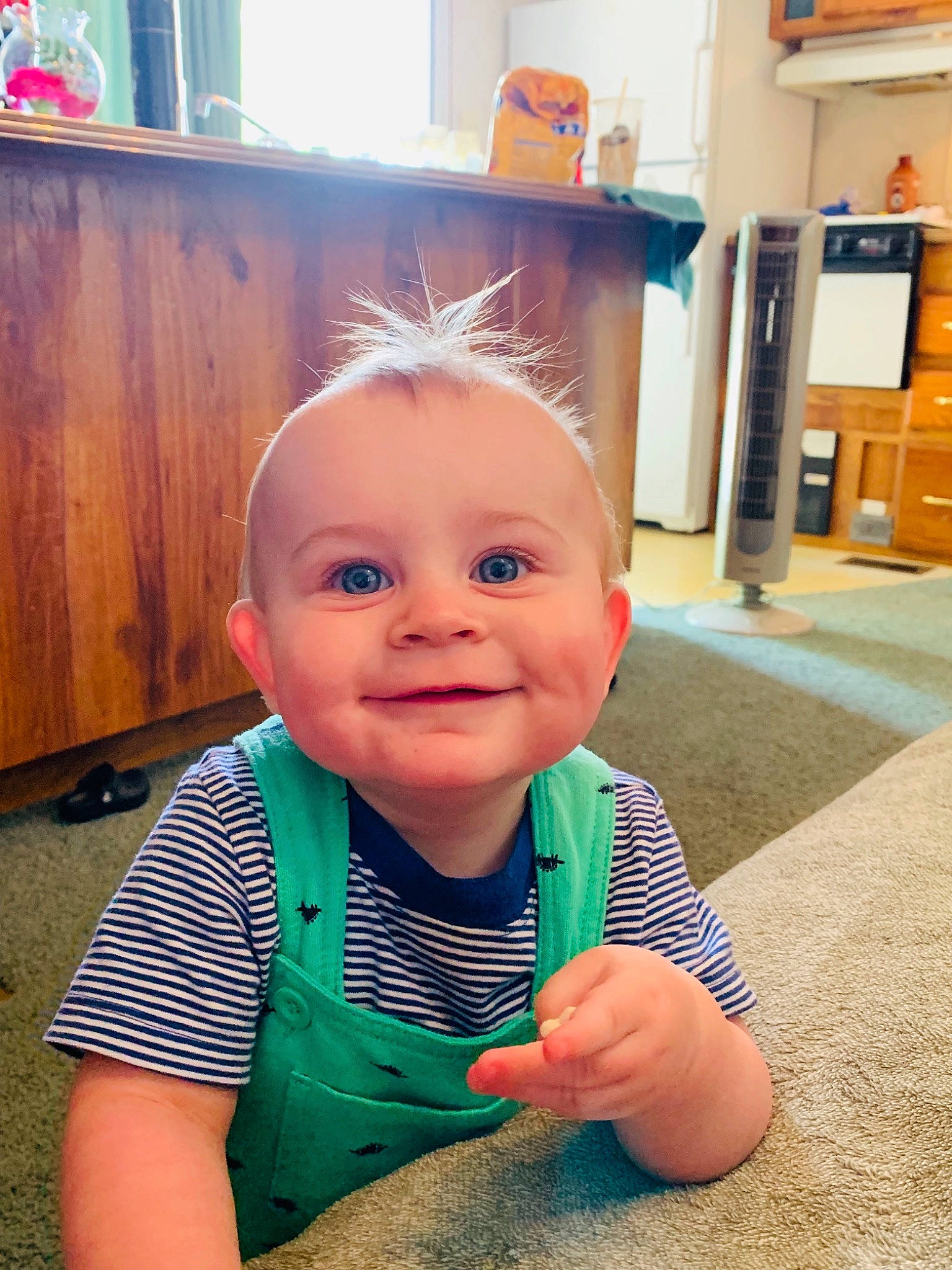 Wilson is registered to the contest to win money with this photo: baby, cheek, child, ear, electronic_device, eye, face, forehead, happy, head, joy, person, play, skin, smile, toddler