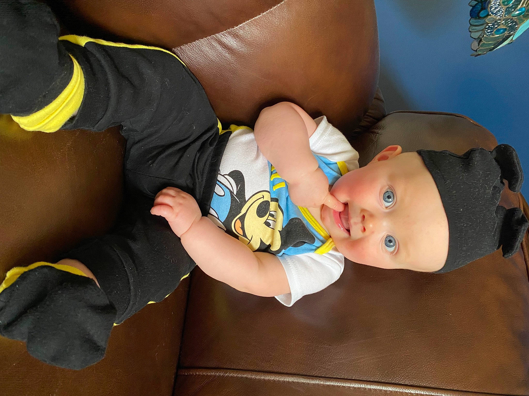 Ryan is registered to the contest to win money with this photo: arm, baby, baby_products, baby_toddler_clothing, chest, child, comfort, elbow, finger, fun, hand, headwear, human_leg, joint, knee, nail, pattern, person, sleeve, surprise
