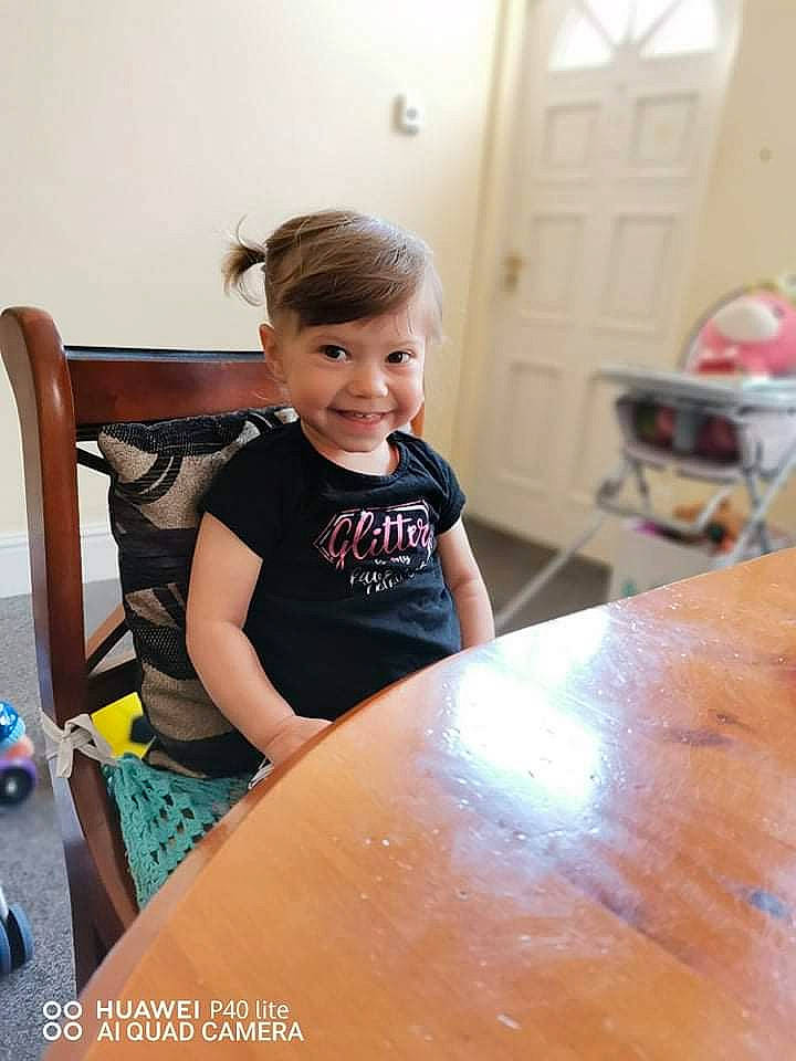 Gabriela is registered to the contest to win money with this photo: chair, child, desk, door, flooring, fun, furniture, happy, hardwood, joy, leisure, person, play, room, sitting, t_shirt, table, toddler, vacation, varnish