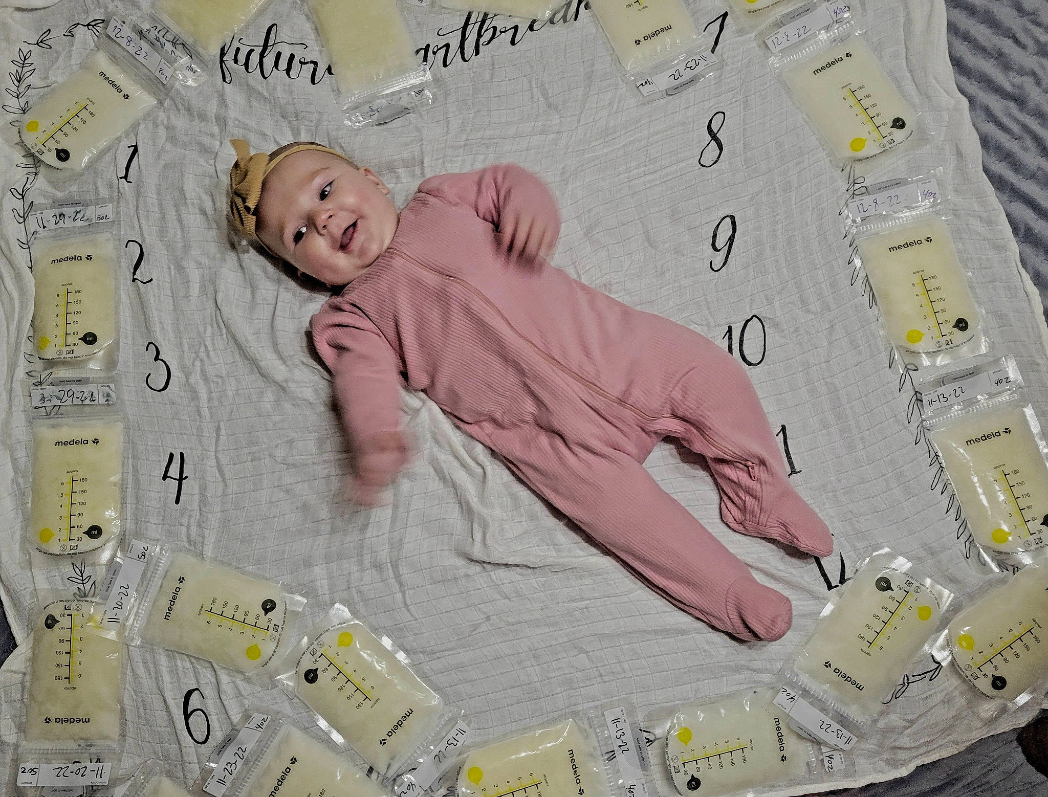 Lorelai is registered to the contest to win money with this photo: baby, baby_products, baby_toddler_clothing, bed, bedding, child, comfort, design, font, happy, linens, paper, paper_product, pattern, person, product, publication, sleeve, t_shirt, textile