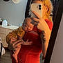 Alayah joined the competition — help win amazing prizes! baby, woman, mirror, selfie, sleeping, holding, phone, tattoo, curtains, hats, bedroom, furniture, wood_floor, red_shirt, yellow_clothing, hand, face, person, indoor, reflection