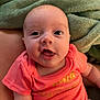 Alayah is registered to the contest to win money with this photo: baby, infant, smiling, face, closeup, onesie, coral, blanket, soft, cute, child, happy, skin, expression, person, newborn, indoors, comfort, portrait, young