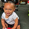 toddler, child, indoor, basketball, smiling, blue_eyes, hair_buns, white_shirt, black_shorts, sneakers, carpet, chair, toy, cute, happy, person, playful, floor, small_basketball, baby