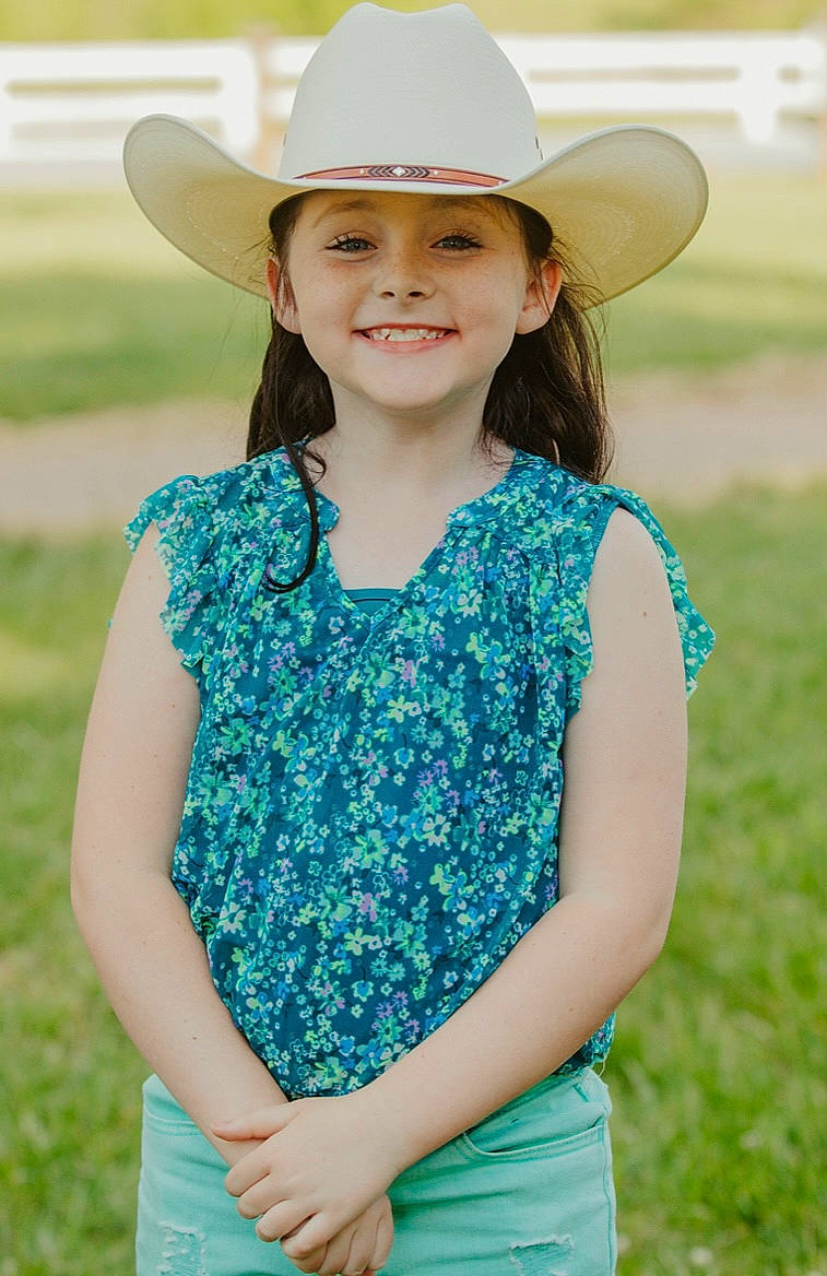 Spirit is registered to the contest to win money with this photo: clothing, day_dress, dress, electric_blue, eye, facial_expression, formal_wear, fun, grass, grassland, happy, hat, headgear, headwear, joy, neck, people, people_in_nature, person, sleeve