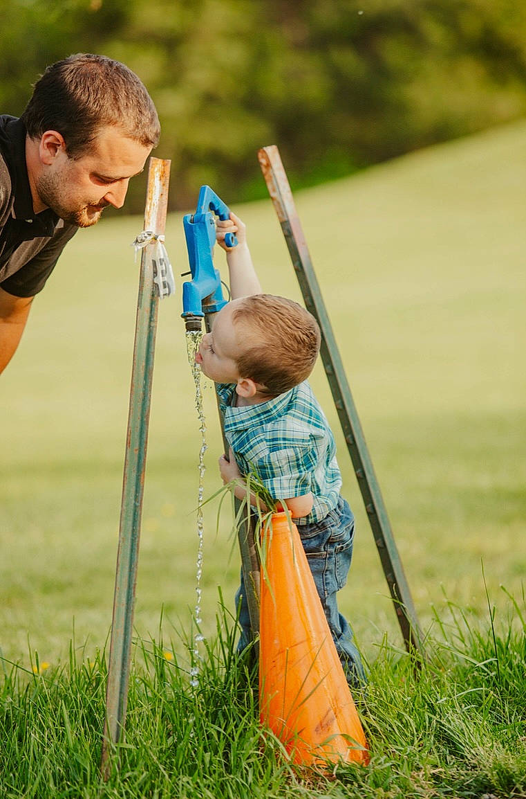 Chase is registered to the contest to win money with this photo: child, fun, grass, grass_family, grassland, happy, lawn, leisure, meadow, people_in_nature, person, plant, pole, recreation, rural_area, soil, spring, t_shirt, toddler, tree