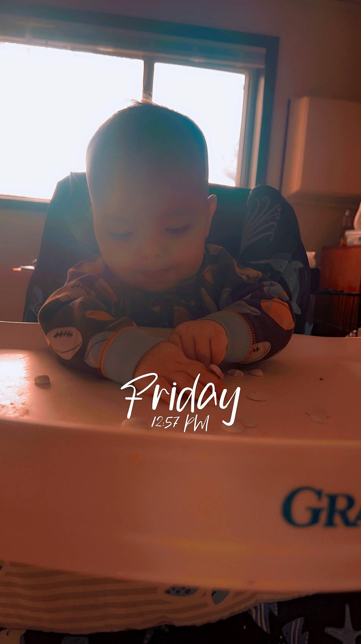 Blaze is registered to the contest to win money with this photo: baby, box, child, comfort, curtain, finger, flooring, font, fun, gadget, hand, lighting_accessory, person, photo_caption, room, sitting, table, toddler, window, wood