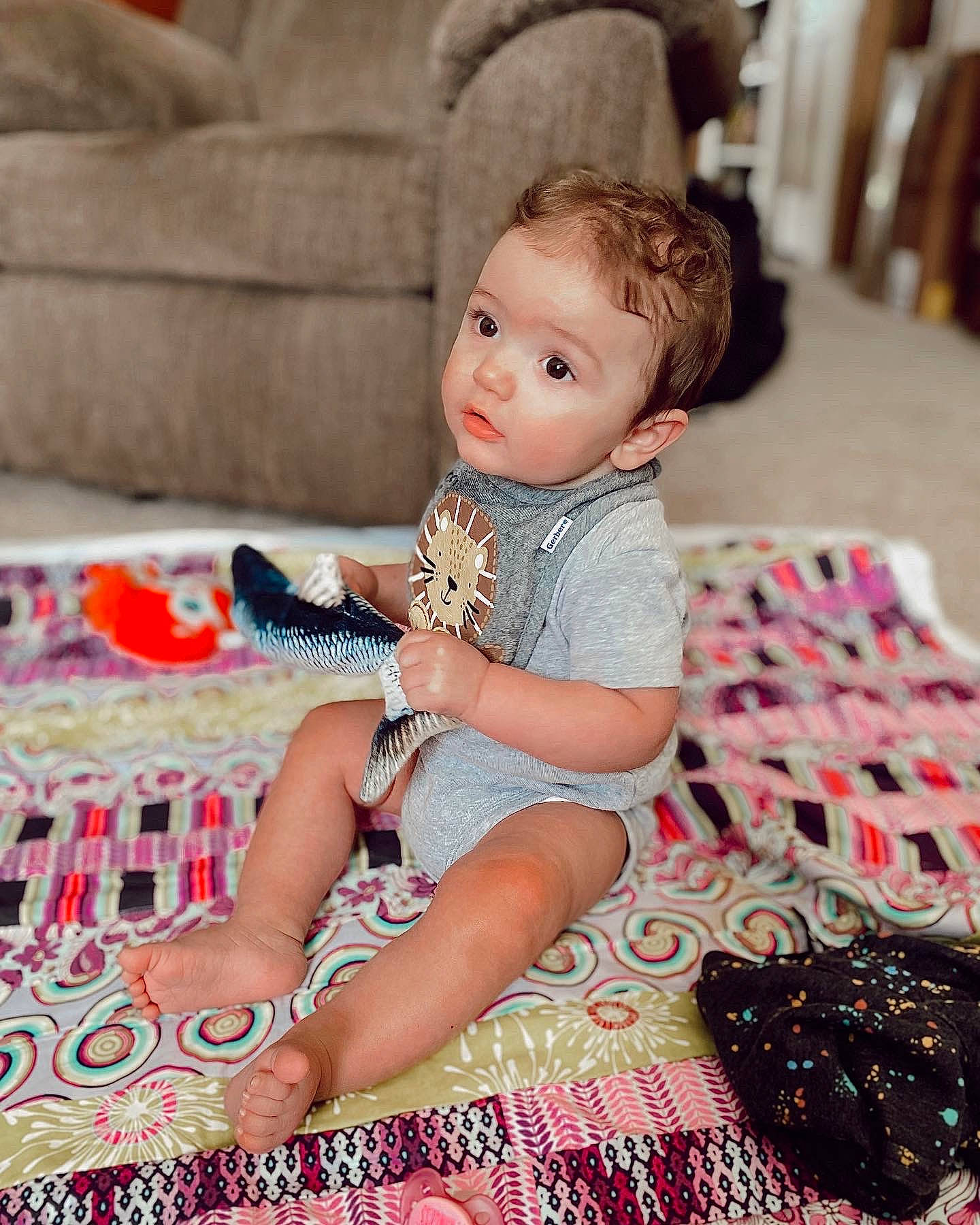 Colt joined the competition — help win amazing prizes! baby, baby_toddler_clothing, child, comfort, couch, flooring, foot, fun, human_leg, lap, living_room, pattern, person, pink, sandal, sitting, skin, textile, thigh, toddler