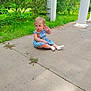 toddler, child, blue_dress, white_socks, sitting, porch, concrete, greenery, plants, pillars, outdoor, daylight, curious, cute, casual, nature, grass, small_child, person, young_kid
