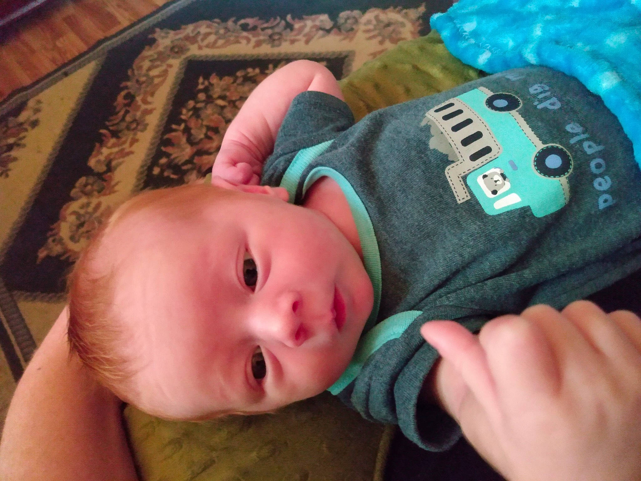 Shane is registered to the contest to win money with this photo: baby, baby_products, baby_sleeping, baby_toddler_clothing, blue, cap, cheek, close_up, comfort, face, finger, hand, lip, mouth, nail, nose, person, skin, thumb, toddler