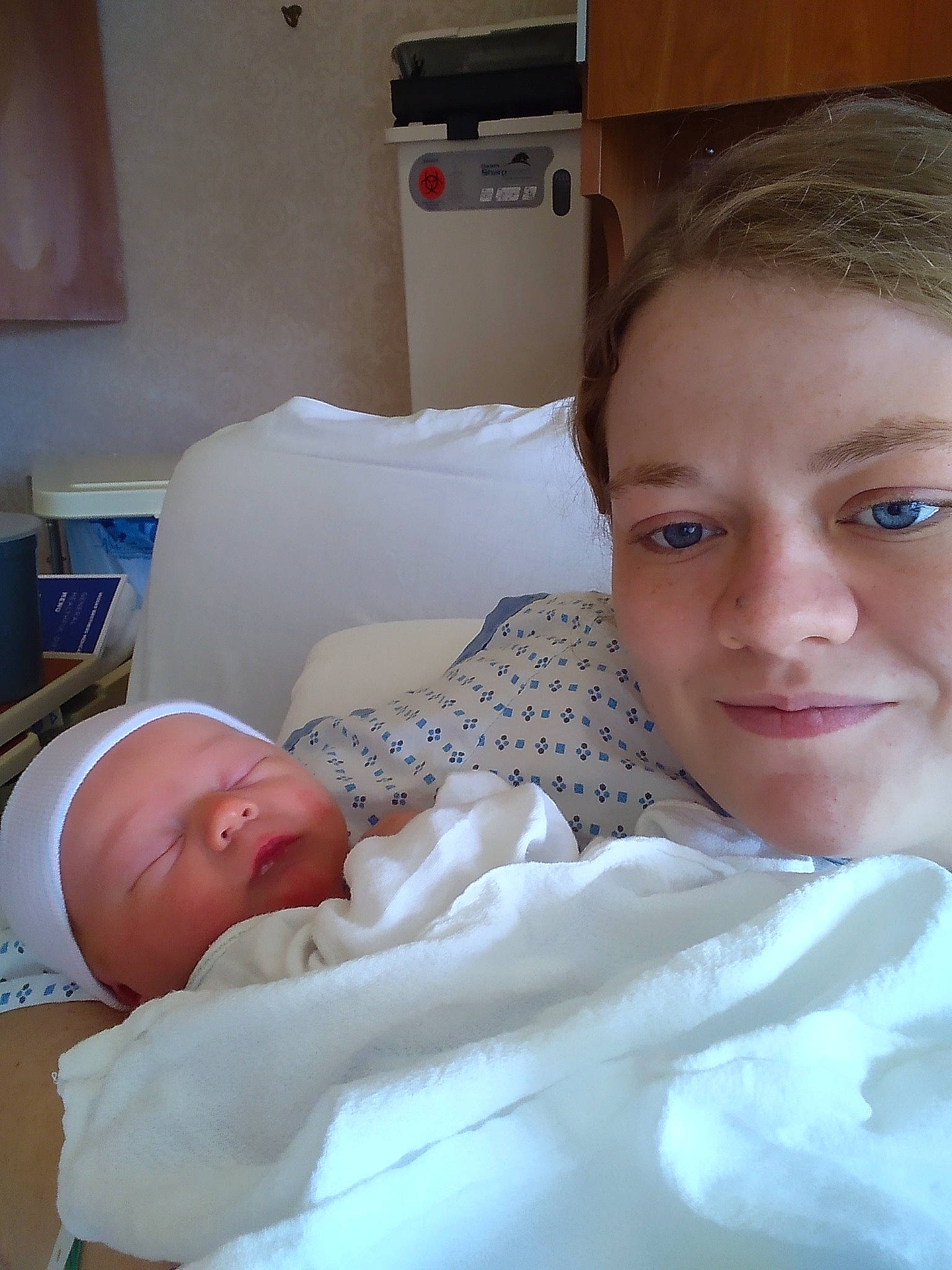 Shane is registered to the contest to win money with this photo: baby, child, chin, comfort, eyelash, health_care, hospital, hospital_bed, joy, linens, medical, medical_procedure, mouth, muscle, organ, patient, person, room, service, skin